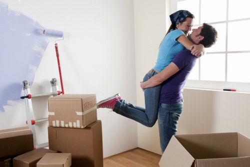 Professional movers handling furniture in a Walthamstow flat move