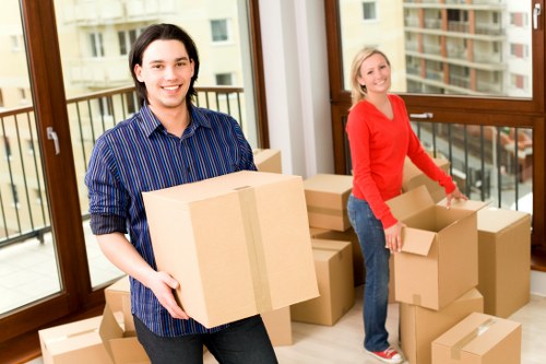 Packed moving boxes and furniture for a Walthamstow home move